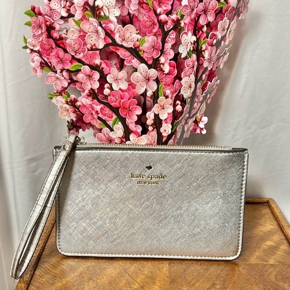 kate spade Handbags - Kate Spade Silver Metallic Wristlet Pouch